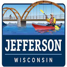 Jefferson Wisconsin Logo - Man rowing in a red kayak arch bridge in the background